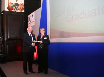 QM&T student receiving Diploma Graduation Award